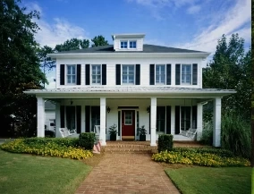 Lawn care Las Cruces NM - freshly mowed and edged front lawn in front of a two-story home